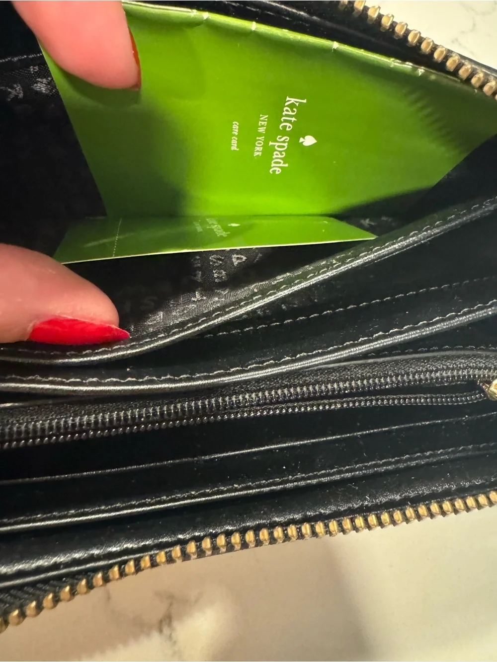 kate spade Black and Cream Bow-Accent Zip Around Wallet